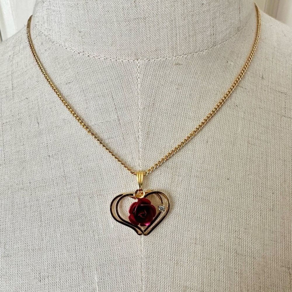 The Marquis Collection gold tone heart pendant with red rose necklace and earrin